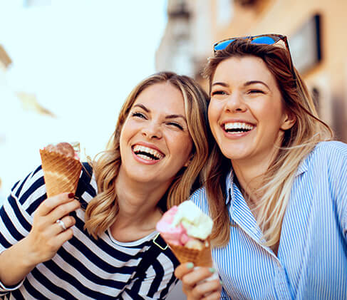 two sisters enjoying ice cream